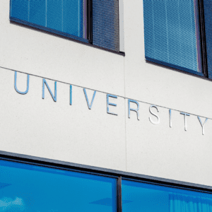 An image of a building with "University" on the wall. 